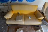 Abandoned Yellow Hotel Couch